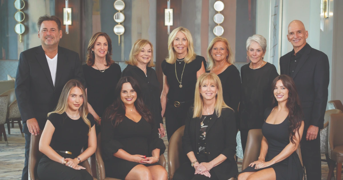 Boca West Realty team assisting buyers at the Welcome Sales Center