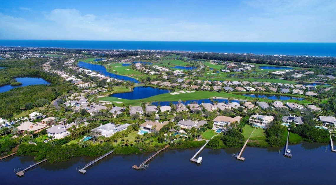 Aerial view of Orchid Island residential community and golf course near the Atlantic Ocean