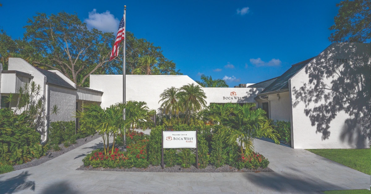 Welcome center entrance with signage and landscaping